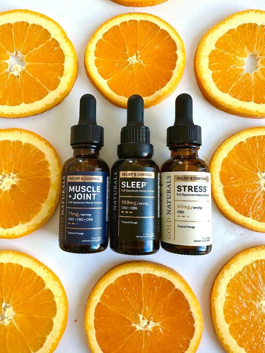 Gold Naturals CBD tinctures with orange slices — CBD dosage guide